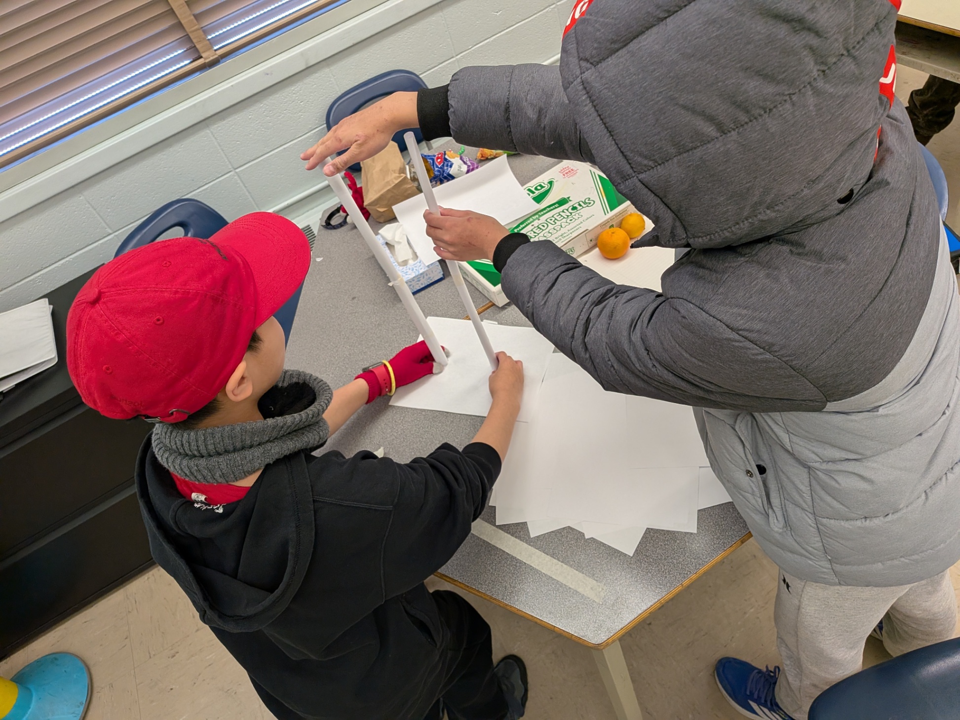 Students constructing tower